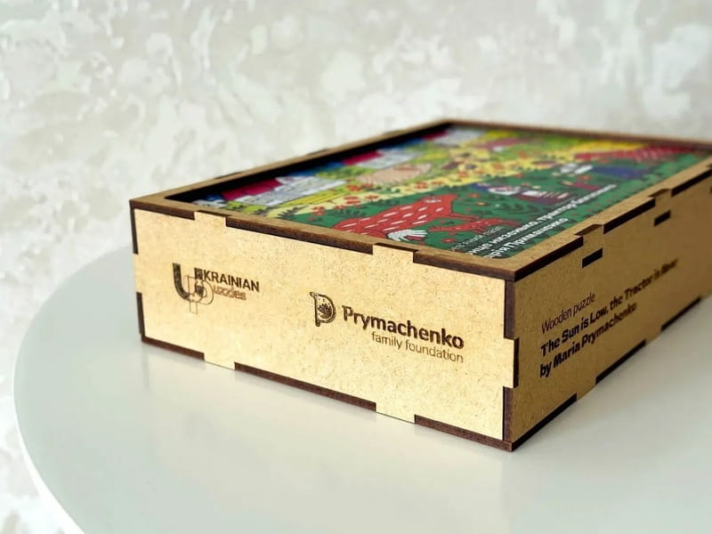 Пазл дерев`яний UkrainianPuzzles Сонце низенько, трактор близенько Марія Примаченко