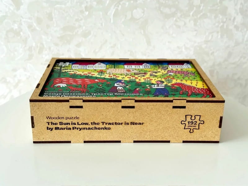 Пазл дерев`яний UkrainianPuzzles Сонце низенько, трактор близенько Марія Примаченко
